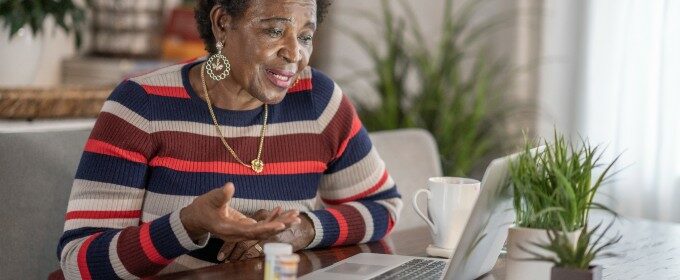 woman with a laptop, on a video call